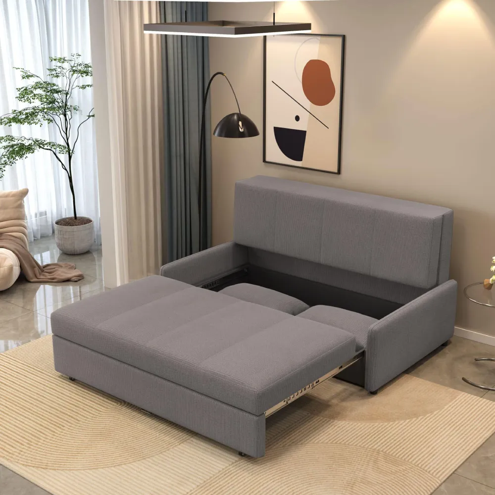 Bambillo Bella Armless Sofa Bed in mid-dark grey fabric colour, showing seat pulled out to show hidden storage under seat and headrest in sofa position