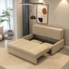 Bambillo Bella Armless Sofa Bed in beige fabric colour, showing seat pulled out to show hidden storage under seat and headrest in sofa position