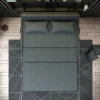 Bambillo Citta Armless Sofa Bed With Headboard in charcoal fabric colour, showing overhead view in bed configuration with headrest folded down