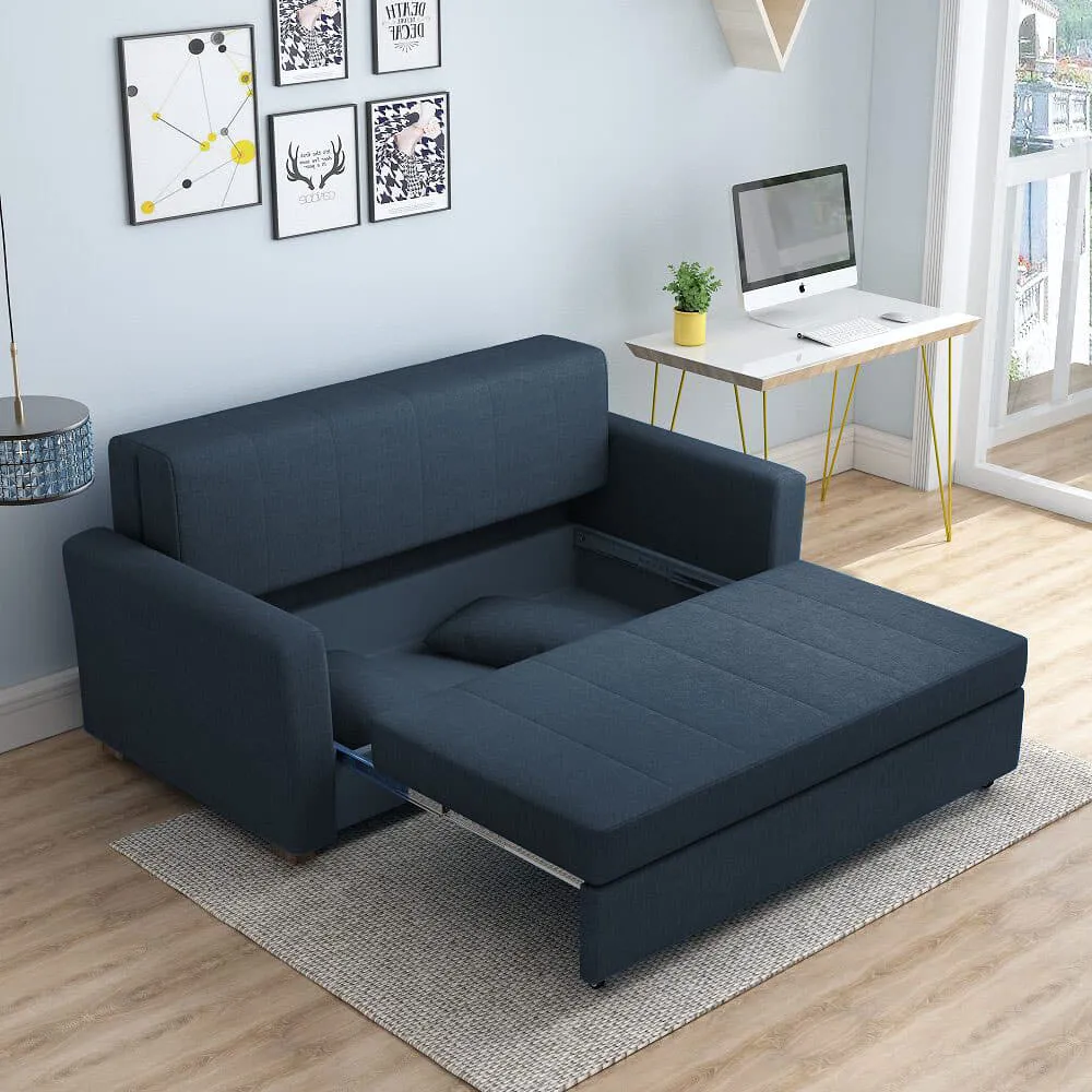 Bambillo Milano Sofa Bed with arms in dark blue fabric colour, showing seat pulled out to show hidden storage under seat and headrest in sofa position