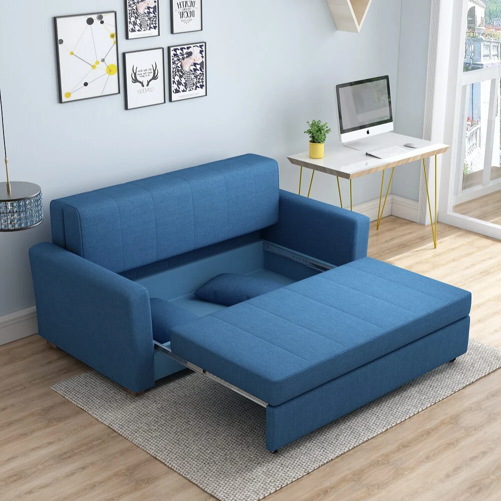 Bambillo Milano Sofa Bed with arms in navy blue fabric colour, showing seat pulled out to show hidden storage under seat and headrest in sofa position