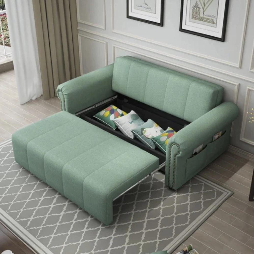 Bambillo Roma Sofa Bed with rolled arms in sage fabric colour, showing seat pulled out to show hidden storage under seat and headrest in sofa position