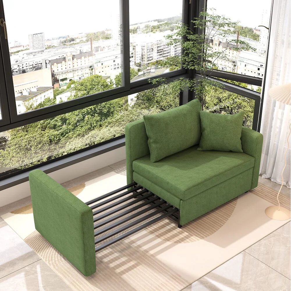 Bambillo Siena Sofa Bed in leaf green fabric, showing right arm pulled out to make bed configuration with seat cushion not folded out