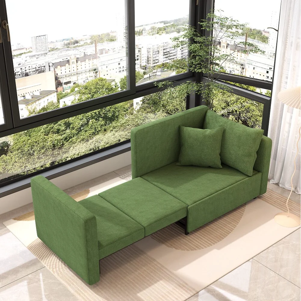 Bambillo Siena Sofa Bed in leaf green fabric, showing right arm pulled out to make bed configuration and seat cushion folded out