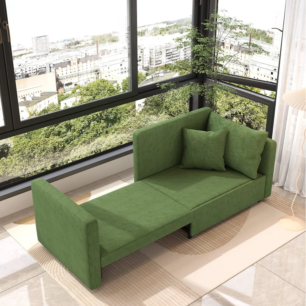 Bambillo Siena Sofa Bed in leaf green fabric, showing right arm pulled out to make bed configuration and seat cushion folded out